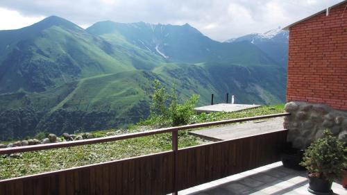a balcony with a view of a mountain at Chalet Marina Gudauri in Gudauri
