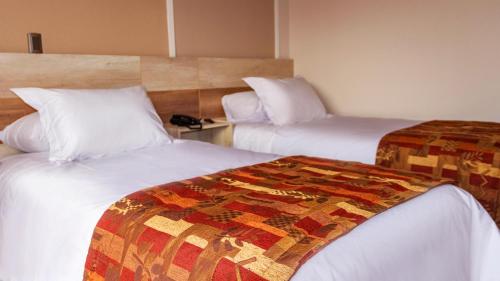 Una cama o camas en una habitación de Hotel Vento