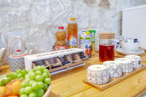 a counter with a bunch of food and fruit on it at Giardini Acantus in Rosolini