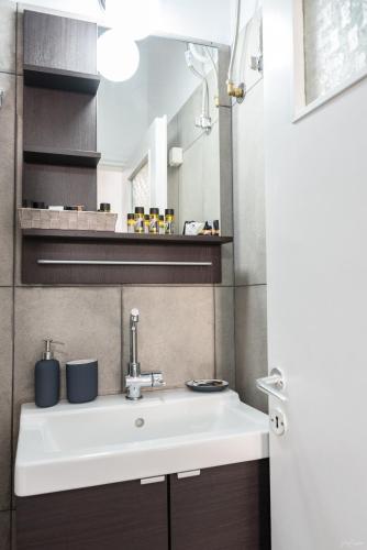 a bathroom with a sink and a mirror at Hydra's Ruby in Hydra