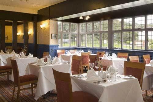 A restaurant or other place to eat at The Bell Hotel 