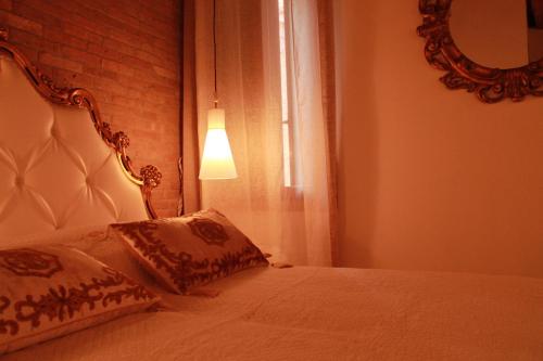 Letto o letti in una camera di Rigoletto Charm