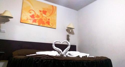 a room with a bed with a heart on it at Hotel Trevi in Salamanca