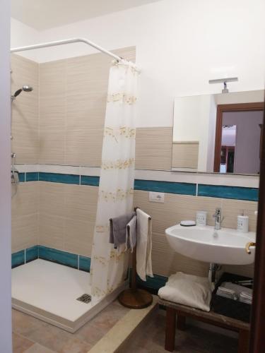 a bathroom with a shower and a sink at Casa Romeo in Taormina