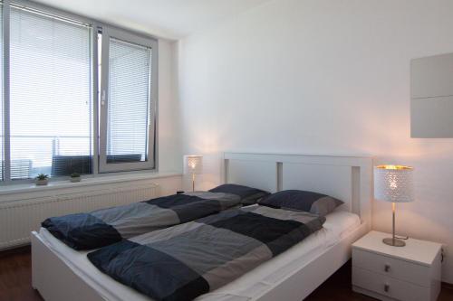 A bed or beds in a room at Juls Apartment next to football and hockey stadium