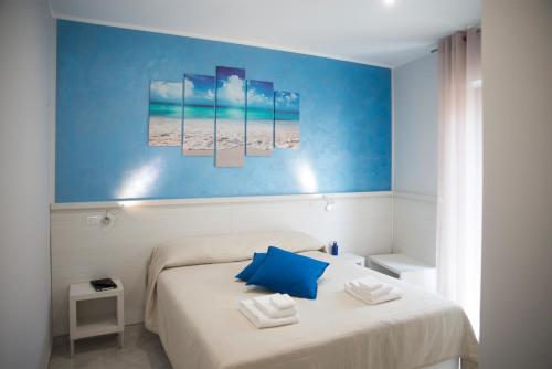 Posteľ alebo postele v izbe v ubytovaní B&B La Pigna