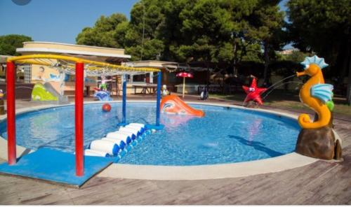 a playground with a pool with at Calle de Frederica Montseny 'Política' Casa o chalet in Valencia