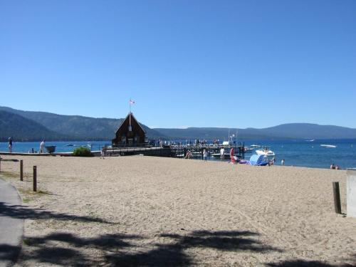 a view of a beach with a building on it at Tahoma Meadows - Sugar Pine Cabin in Tahoma