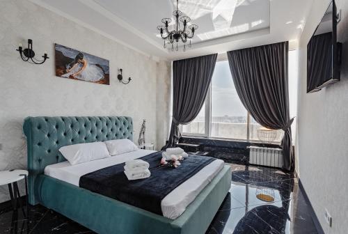 Кровать или кровати в номере Apartments Arcadia. Gagarin Plaza