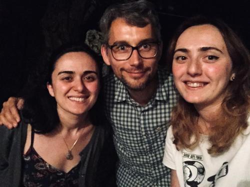 a man and two women posing for a picture at Butichi Guest House in Chiatʼura
