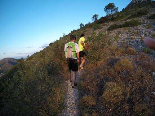 two men walking down a trail on a hill at Tenuta San Giovanni Lucca in Lucca