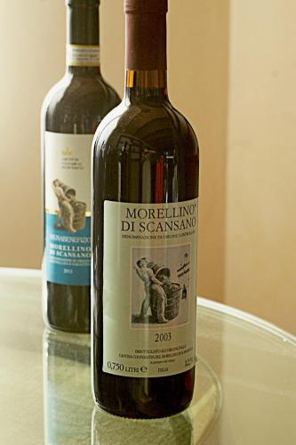 two bottles of wine sitting on top of a table at Agriturismo Poggio alle Calle in Saturnia