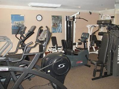 a gym with several exercise equipment in a room at Resort Style In Aventura Florida in Aventura