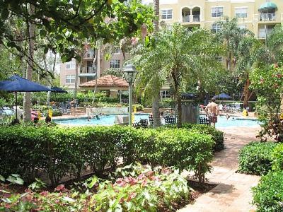 a resort with a swimming pool and a building at Resort Style In Aventura Florida in Aventura