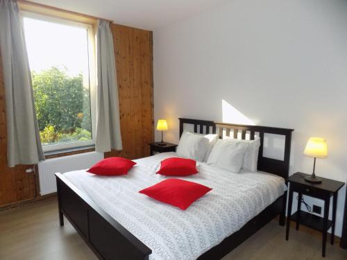 a bedroom with a large bed and a large window at Maison Roosevelt - Charleroi Airport - Ideal Families in Charleroi