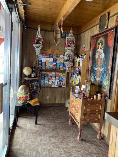 a shop with a room filled with lots of items at Cottonwood Court Motel in Santa Fe