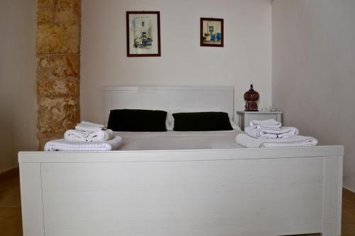 En eller flere senger på et rom på La Violetta Ostuni