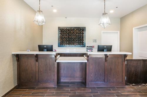 a kitchen with a sink and a counter top at Hotel Siri Downtown - Paso Robles in Paso Robles