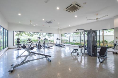 a gym with treadmills and cardio equipment in a building at SetiaWalk {BIG GROUP}12Pax WIFI 2C'Park IOI SUNWAY SUBANG USJ in Puchong