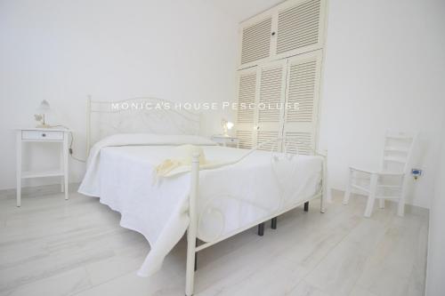 Кровать или кровати в номере Home Holiday Salento Monica's House Pescoluse