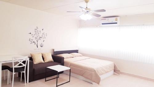Ένα ή περισσότερα κρεβάτια σε δωμάτιο στο Popular Condo C8