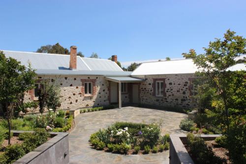 a house with a garden in front of it at Oxenberry Farm in McLaren Vale
