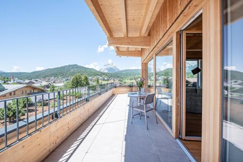 a balcony with a view of the mountains at GOTTHARD - FINE LIVING APARTMENTS in Seefeld in Tirol