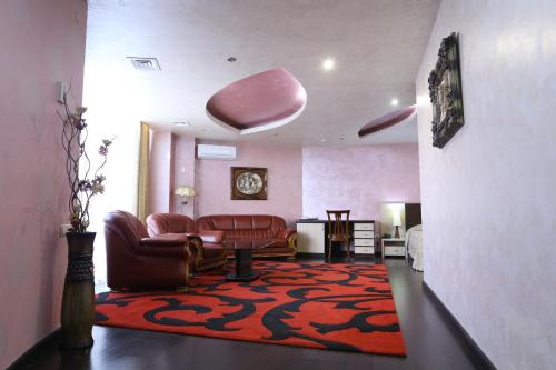 a living room with a couch and a rug at Vanatur Hotel in Gyumri