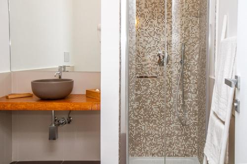 a bathroom with a shower with a sink at Don Franco in Adelfia