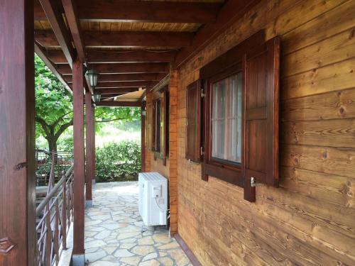 a wooden house with a toilet on the side of it at WOODEN HOUSE IN IOANNINA in Ioannina