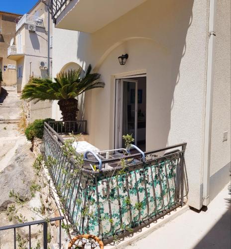 a bike parked on the side of a house at Apartments Dvor - ap1, ap2, ap3 in Baška Voda