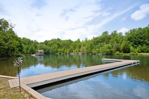 a dock in the middle of a lake at Pebble Beach in Bumpass