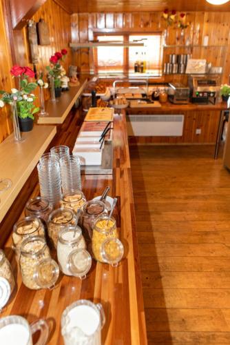 a kitchen with a long counter with jars on it at Hótel Eyjafjallajökull in Hvolsvöllur