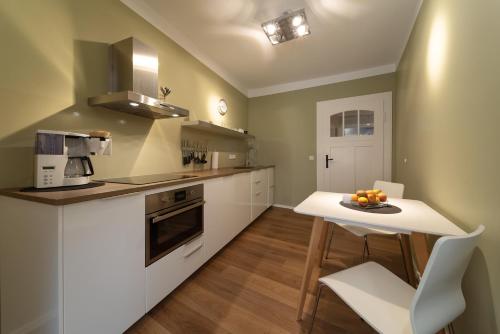 Kuchyň nebo kuchyňský kout v ubytování Carl.22 City Appartements