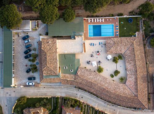 an aerial view of a building with a yard at Hotel Fiore Di Maggio in Villasimius
