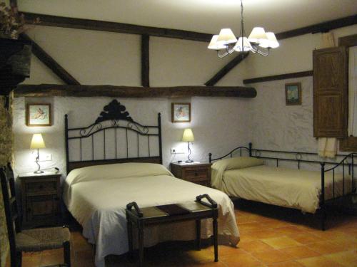 Postel nebo postele na pokoji v ubytování Casa rural ca l'Antoni (Tarragona)