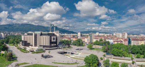 a large park in a city with buildings at Rosslyn Central Park Hotel Sofia in Sofia
