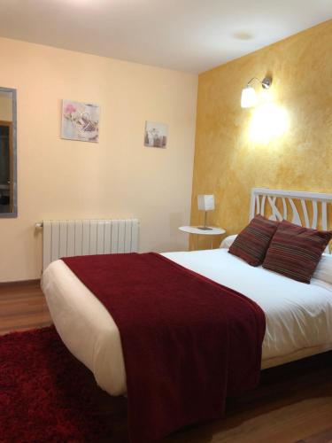 Un pat sau paturi într-o cameră la Hotel gela