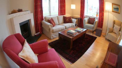 a living room with couches and a coffee table at Blind Gate House in Kinsale