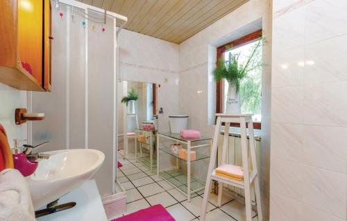 a bathroom with a sink and a mirror at AS Apartments with swimming pool and a large yard in Bribir