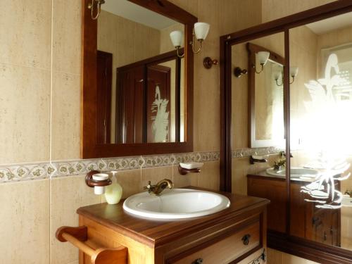 a bathroom with a sink and a mirror at Casa La Antigua Almazara in Cazorla