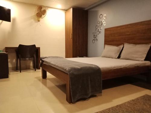 Postel nebo postele na pokoji v ubytování Tranquil Serviced Apartments