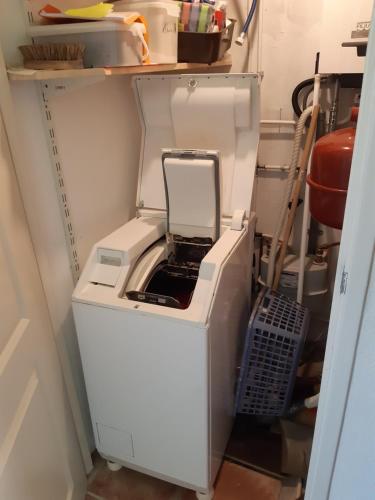 a white computer printer sitting in a room at Zeeuws Huisje Colijnsplaat in Colijnsplaat