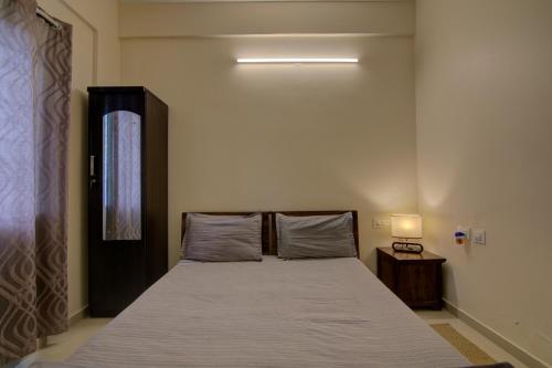 Postel nebo postele na pokoji v ubytování Tranquil Serviced Apartments