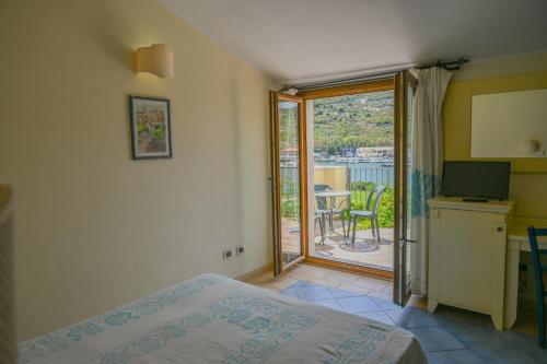 Postel nebo postele na pokoji v ubytování Hotel Baja Romantica