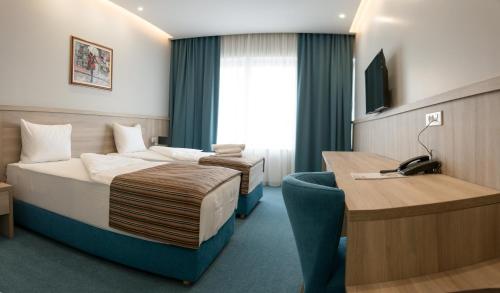 Un pat sau paturi într-o cameră la Hotel Jelena