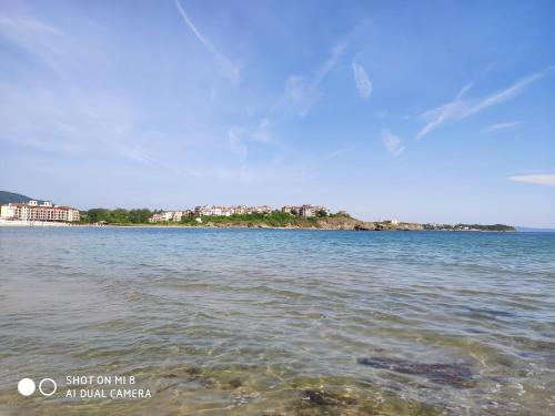 a large body of water with buildings in the background at INESA in Tsarevo