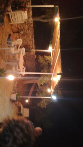 an overhead view of a backyard with lights and a house at Trullo Le Tre Sorelle in Cisternino