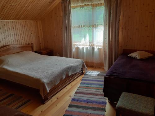Postel nebo postele na pokoji v ubytování WoodDream