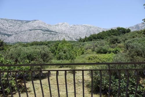a view of the mountains from a balcony at Apartments Nevenka i Josko in Tučepi